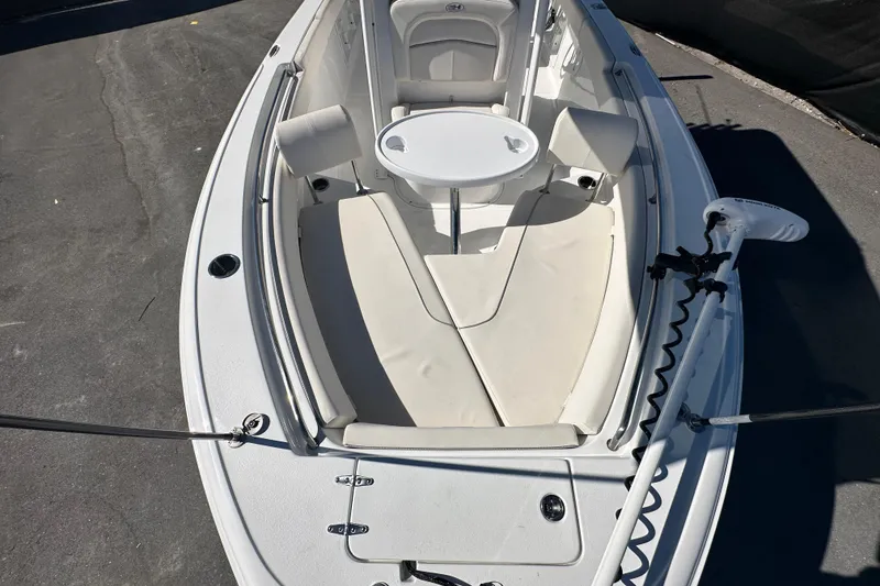 Slide: The Image of 2024 Sea Hunt Ultra 219 boat interior with seating and table setup. - 41