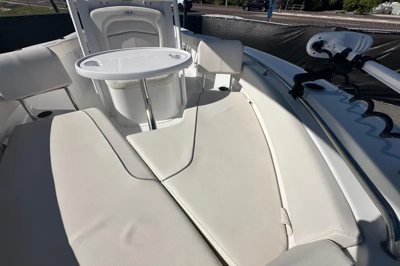 Slide: The Image of 2024 Sea Hunt Ultra 219 boat interior with seating and table. - 42