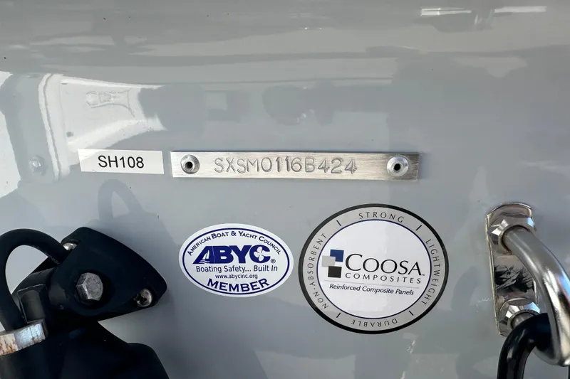 Slide: The Image of 2024 Sea Hunt Ultra 219 boat with ABYC and Coosa Composites labels. - 5