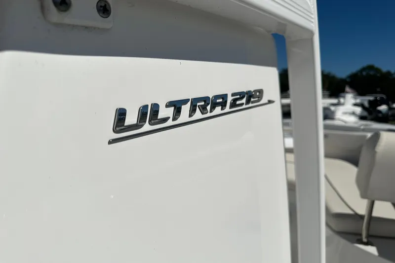 Slide: The Image of 2024 Sea Hunt Ultra 219 boat logo on white surface. - 63