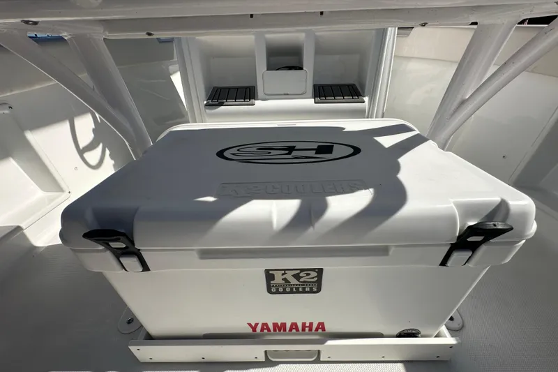 Slide: The Image of 2024 Sea Hunt Ultra 219 boat interior with K2 cooler and Yamaha branding. - 66