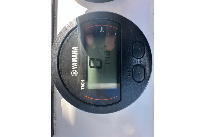 Slide: The Image of Yamaha tachometer on 2024 Sea Hunt Ultra 219 boat dashboard. - 75