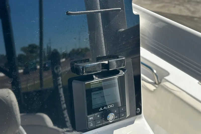 Slide: The Image of 2024 Sea Hunt Ultra 219 boat with JL Audio system on dashboard. - 77