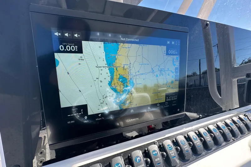 Slide: The Image of Garmin navigation display on 2024 Sea Hunt Ultra 219 boat dashboard. - 79
