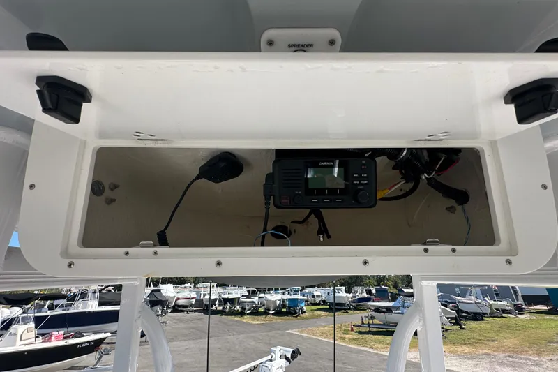 Slide: The Image of 2024 Sea Hunt Ultra 219 boat console with Garmin radio and wiring. - 83