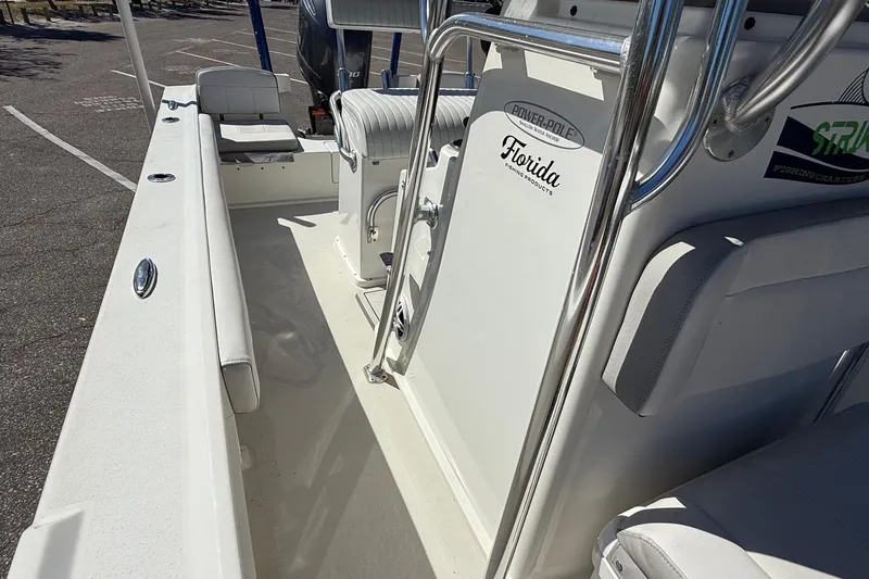 Slide: The Image of 2022 Parker 2100 Special Edition boat interior with seating and fishing gear. - 12