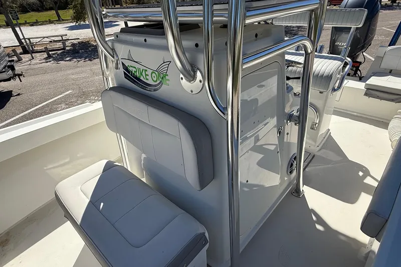 Slide: The Image of 2022 Parker 2100 Special Edition boat interior with seating and chrome details. - 15
