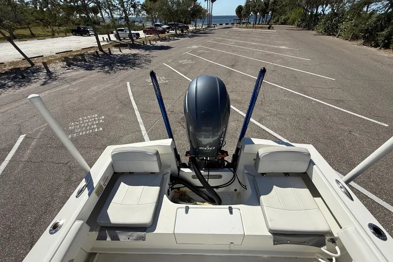 Slide: The Image of 2022 Parker 2100 Special Edition boat in parking lot, rear view with motor. - 8