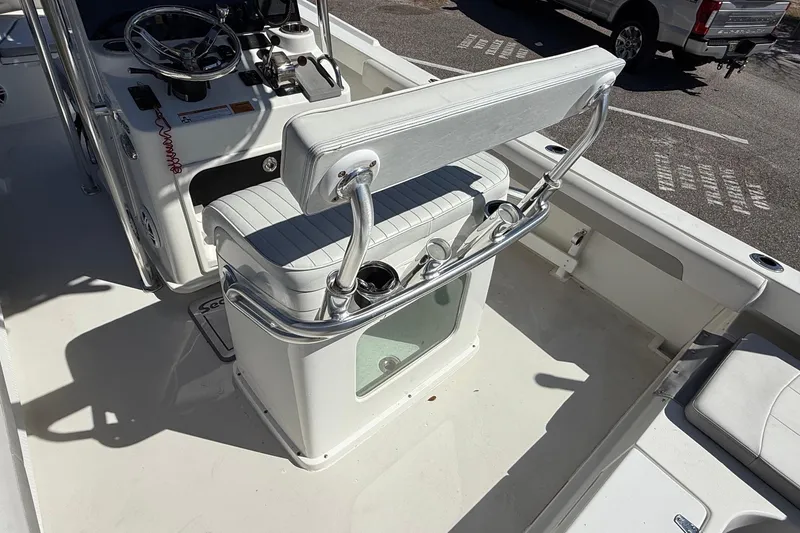 Slide: The Image of 2022 Parker 2100 Special Edition boat interior with steering console and seating. - 9