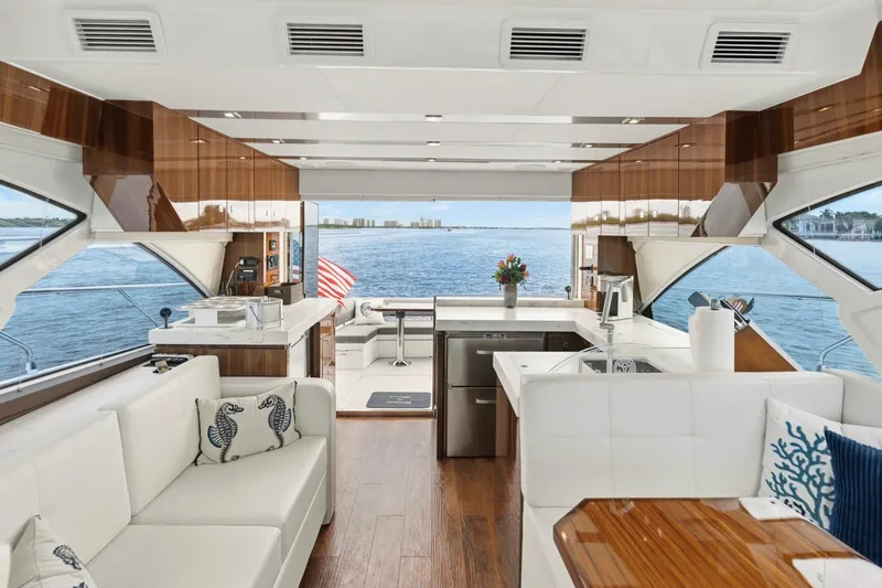Slide: The Image of Luxurious interior of 2022 Cruisers Yachts 54 Cantius with elegant furnishings and ocean view. - 32