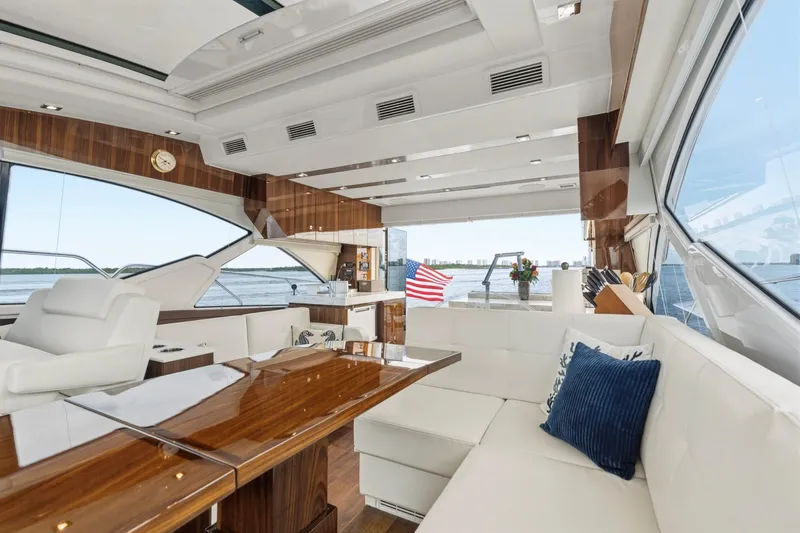 Slide: The Image of Luxurious interior of 2022 Cruisers Yachts 54 Cantius with elegant seating and wooden accents. - 33