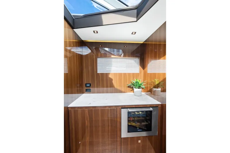 Slide: The Image of Luxurious interior of 2022 Cruisers Yachts 54 Cantius with sleek wood finish and modern amenities. - 35
