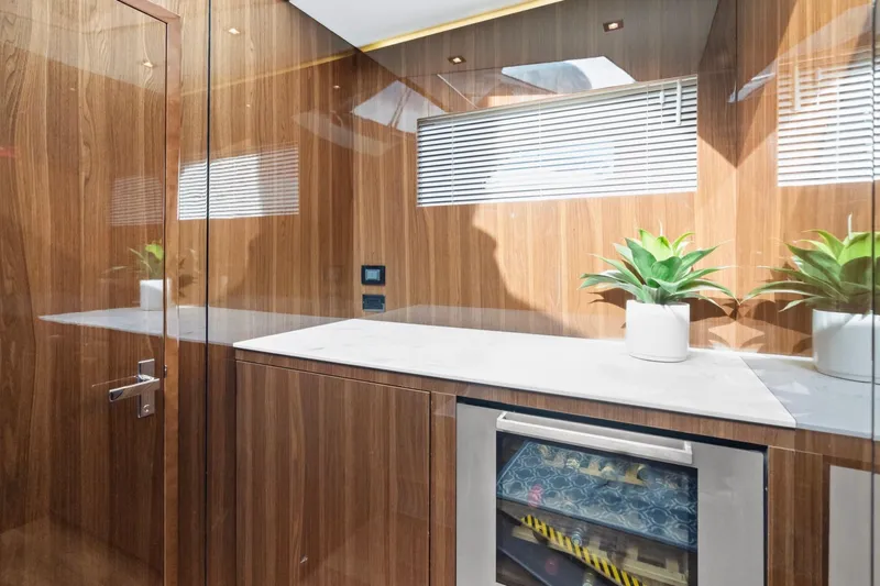 Slide: The Image of Luxurious 2022 Cruisers Yachts 54 Cantius interior with wood paneling and modern decor. - 36