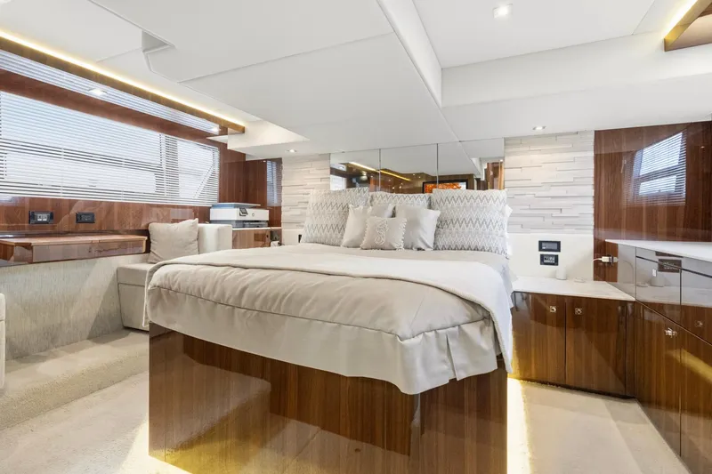 Slide: The Image of Luxurious bedroom interior of 2022 Cruisers Yachts 54 Cantius with elegant wood finishes. - 41