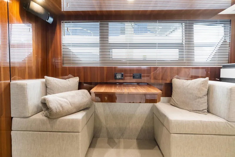 Slide: The Image of Luxurious interior of 2022 Cruisers Yachts 54 Cantius with elegant seating and wooden accents. - 47