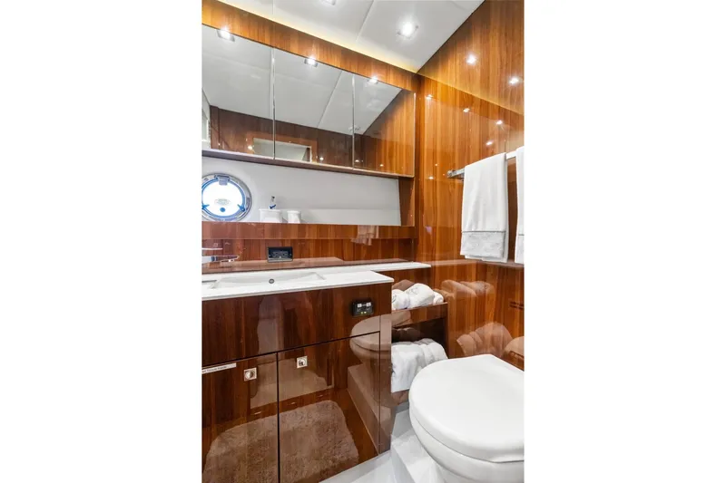 Slide: The Image of Luxurious bathroom in 2022 Cruisers Yachts 54 Cantius with wood finish and modern fixtures. - 50