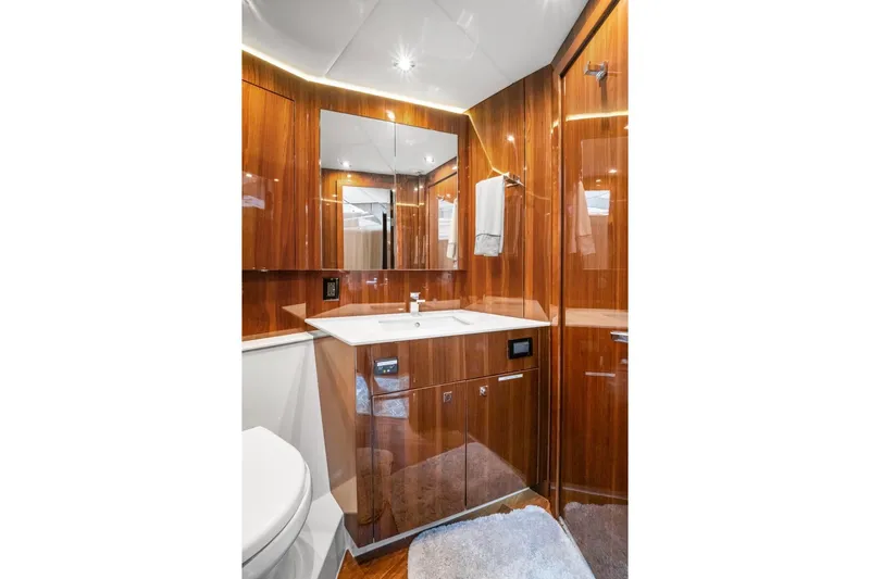 Slide: The Image of Luxurious bathroom in 2022 Cruisers Yachts 54 Cantius with wood cabinetry and modern fixtures. - 59