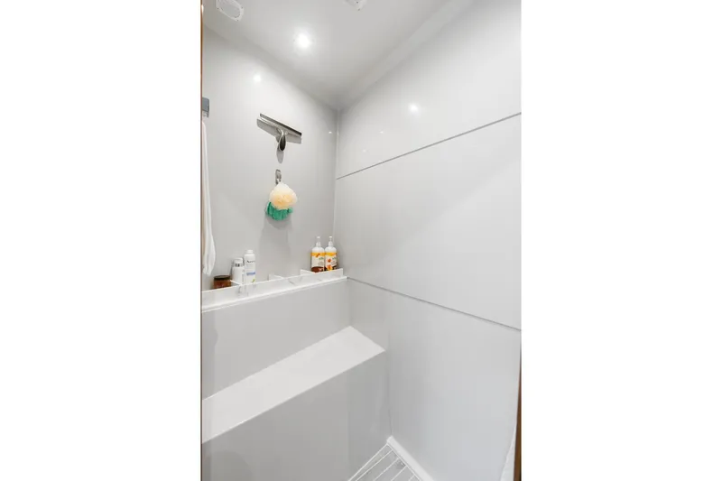 Slide: The Image of Luxurious shower area in 2022 Cruisers Yachts 54 Cantius, featuring modern fixtures and amenities. - 62