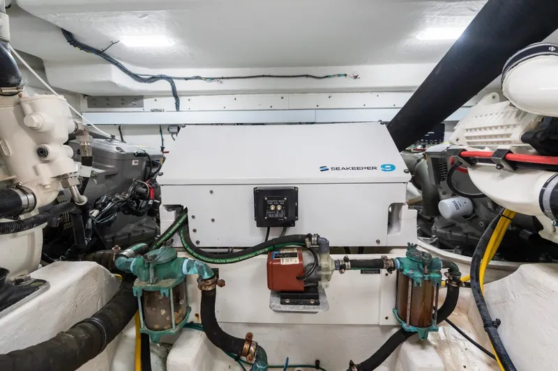Slide: The Image of Engine room of 2022 Cruisers Yachts 54 Cantius featuring Seakeeper 9 stabilizer. - 71