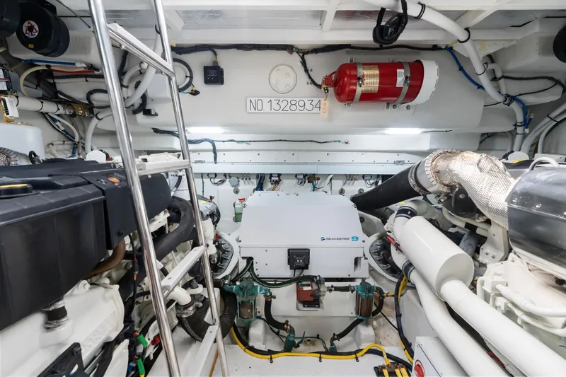 Slide: The Image of Engine room of 2022 Cruisers Yachts 54 Cantius, featuring Seakeeper 9 stabilizer. - 72
