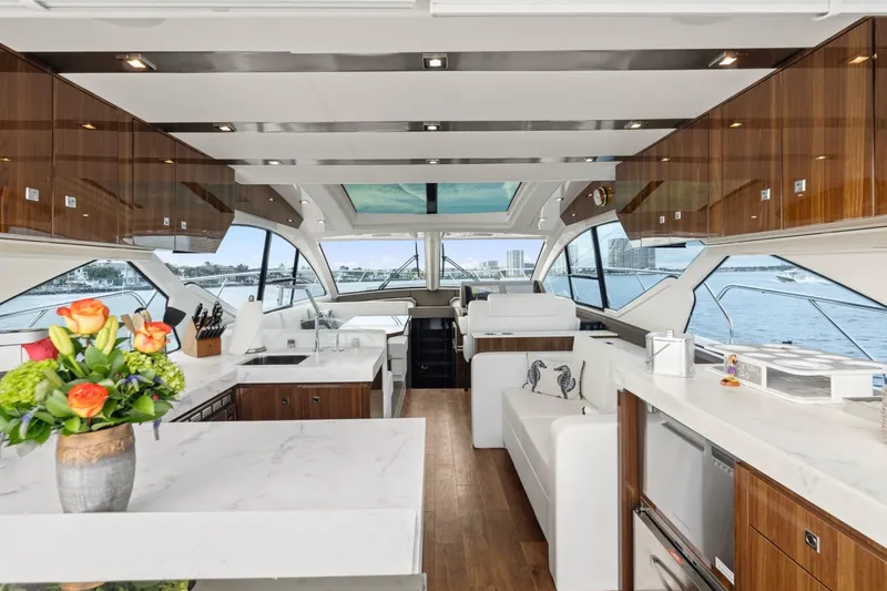 Slide: The Image of Luxurious interior of 2022 Cruisers Yachts 54 Cantius with modern design and waterfront view. - 23