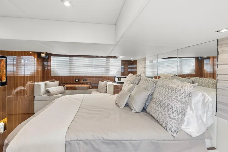 Slide: The Image of Luxurious bedroom interior of 2022 Cruisers Yachts 54 Cantius with elegant decor and plush bedding. - 45
