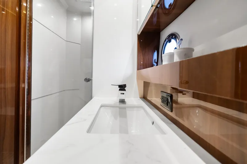 Slide: The Image of Luxurious bathroom interior of 2022 Cruisers Yachts 54 Cantius with modern sink and fixtures. - 51