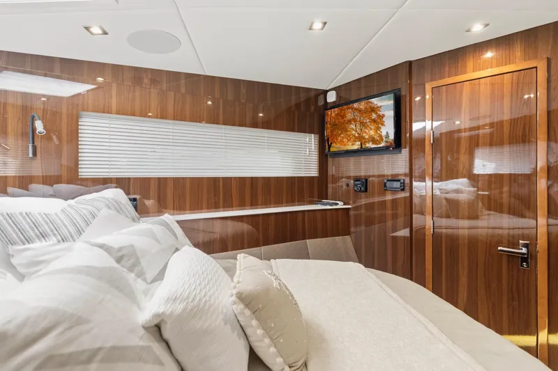 Slide: The Image of Luxurious interior of 2022 Cruisers Yachts 54 Cantius with wood paneling and modern amenities. - 56