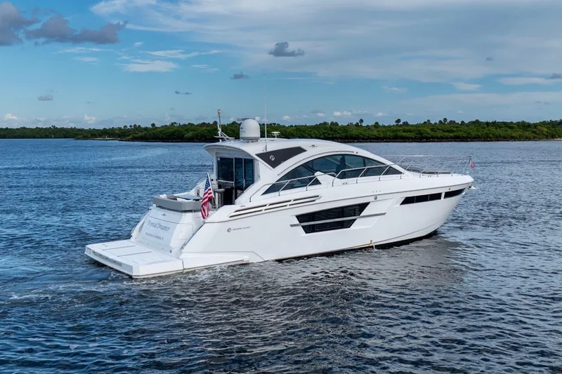 Slide: The Image of 2022 Cruisers Yachts 54 Cantius luxury boat cruising on open water. - 6