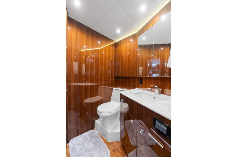 Slide: The Image of Luxurious bathroom in 2022 Cruisers Yachts 54 Cantius with sleek wood paneling and modern fixtures. - 61