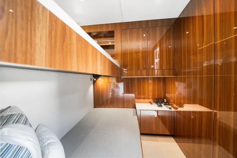 Slide: The Image of 2022 Cruisers Yachts 54 Cantius interior with sleek wood paneling and modern design. - 64