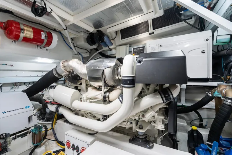 Slide: The Image of Engine room of 2022 Cruisers Yachts 54 Cantius, featuring advanced marine equipment. - 70