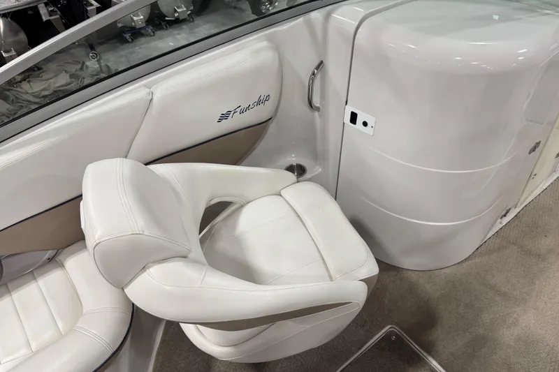 Slide: The Image of 2006 Four Winns 244 Funship interior with white seating and sleek design. - 10