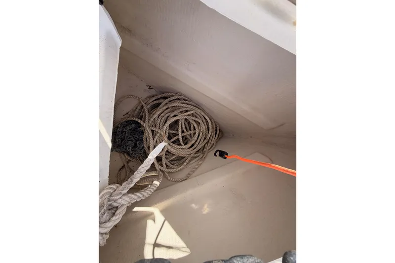 Slide: The Image of Coiled rope in storage compartment of 2003 Beneteau Oceanis Clipper 473 sailboat. - 19