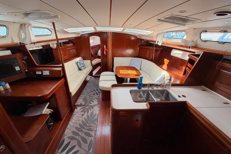 Slide: The Image of Luxurious interior of 2003 Beneteau Oceanis Clipper 473 yacht with elegant wood finish. - 31