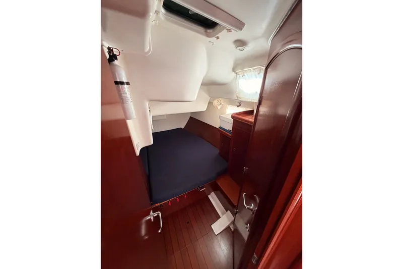 Slide: The Image of Cozy cabin interior of 2003 Beneteau Oceanis Clipper 473 sailboat with wooden finish. - 42