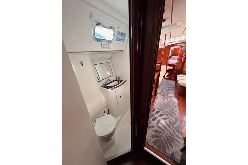 Slide: The Image of Beneteau Oceanis Clipper 473, 2003 model, yacht interior with bathroom and cabin view. - 45