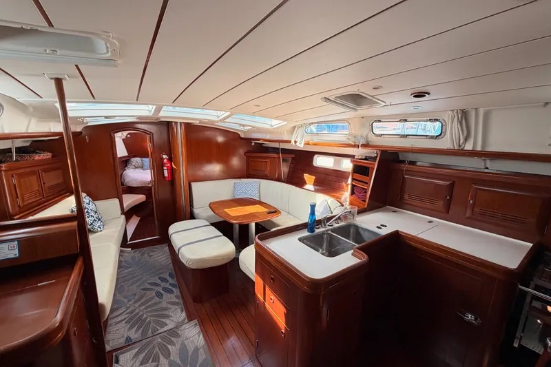 Slide: The Image of Luxurious interior of 2003 Beneteau Oceanis Clipper 473 yacht with elegant wood finish. - 46