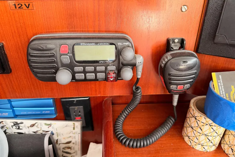 Slide: The Image of VHF radio equipment on 2003 Beneteau Oceanis Clipper 473 yacht dashboard. - 50