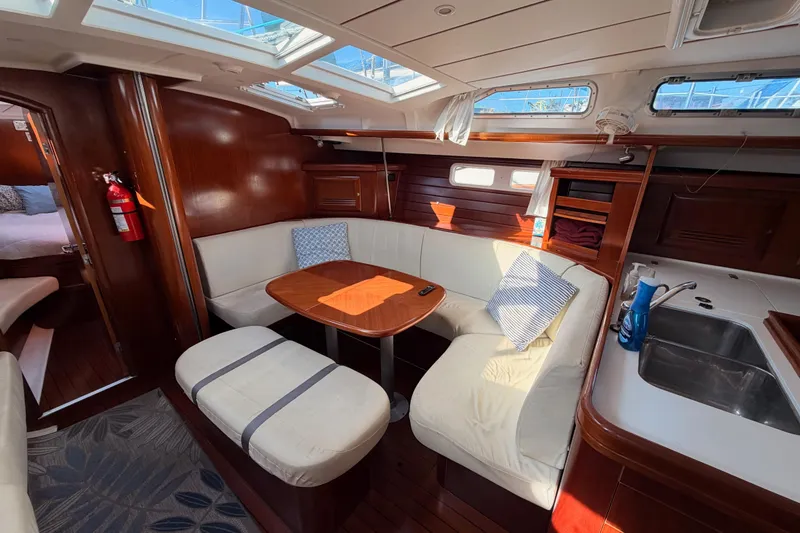Slide: The Image of Luxurious interior of 2003 Beneteau Oceanis Clipper 473 yacht with cozy seating area. - 51