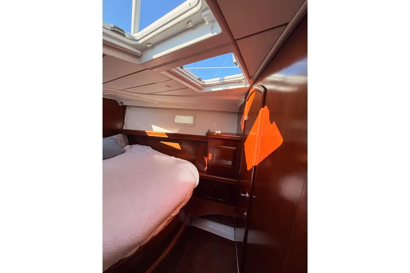Slide: The Image of Cozy cabin interior of 2003 Beneteau Oceanis Clipper 473 sailboat with skylight. - 57