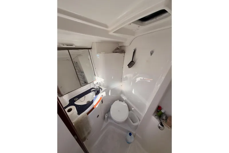 Slide: The Image of Bathroom interior of 2003 Beneteau Oceanis Clipper 473 yacht, featuring sink and toilet. - 58