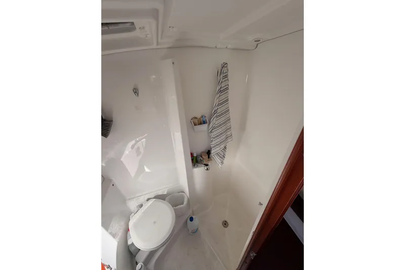 Slide: The Image of Bathroom interior of 2003 Beneteau Oceanis Clipper 473 yacht, featuring shower and toilet. - 59