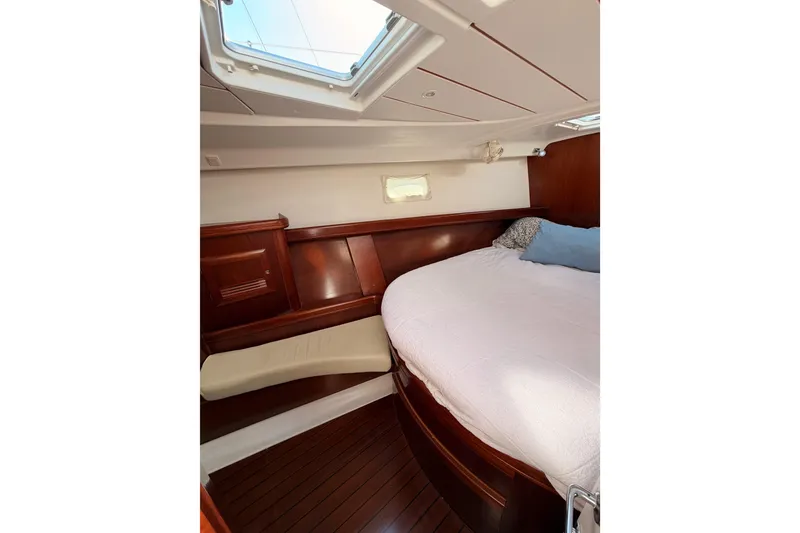 Slide: The Image of Cozy cabin interior of 2003 Beneteau Oceanis Clipper 473 with wooden finish and skylight. - 60