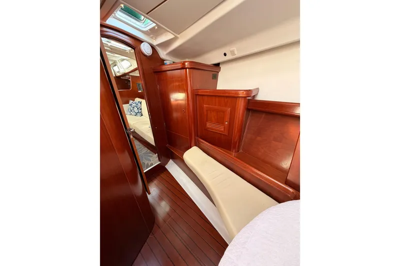 Slide: The Image of Luxurious interior of 2003 Beneteau Oceanis Clipper 473 sailboat with polished wood finish. - 61