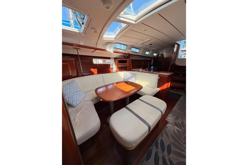 Slide: The Image of Interior of 2003 Beneteau Oceanis Clipper 473 yacht with cozy seating and skylights. - 63
