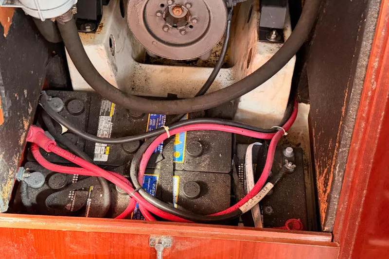 Slide: The Image of Battery compartment of a 2003 Beneteau Oceanis Clipper 473 sailboat with visible wiring. - 66