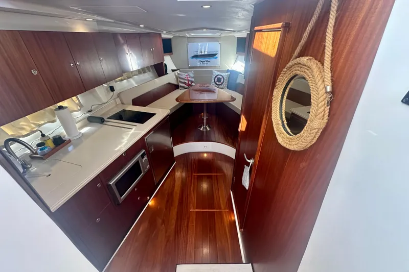 Slide: The Image of Luxurious interior of 2015 Pursuit SC 365i Sport Coupe with modern kitchen and seating area. - 22