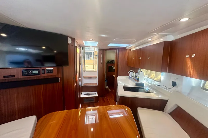 Slide: The Image of Luxurious interior of 2015 Pursuit SC 365i Sport Coupe with wood finishes and modern amenities. - 27