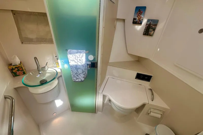 Slide: The Image of 2015 Pursuit SC 365i Sport Coupe bathroom with modern sink, toilet, and decor. - 31